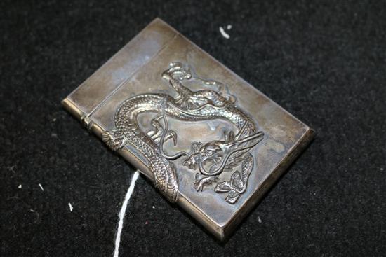 Japanese silver card case cast with a sinuous dragon(-)